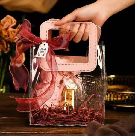 BOLSA ASA CUADRADA CUERINA ROSADO – PVC TRANSPARENTE 17.5x20X9.5