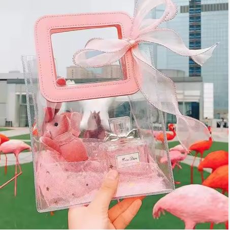 BOLSA ASA CUADRADA CUERINA ROSADO – PVC TRANSPARENTE 17.5x20X9.5