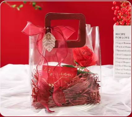 BOLSA ASA CUADRADA CUERINA VINO - PVC TRANSPARENTE 24.5x27.5x14