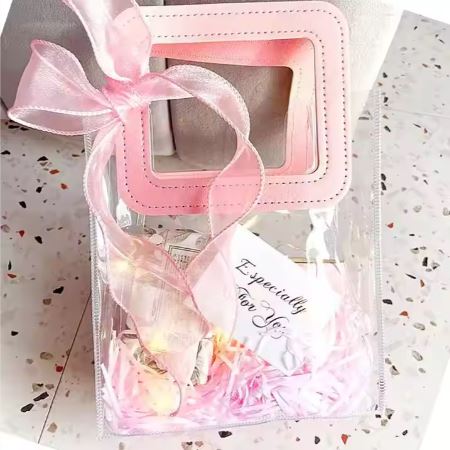 BOLSA ASA CUADRADA CUERINA ROSADO – PVC TRANSPARENTE 17.5x20X9.5