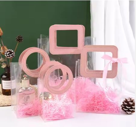 BOLSA ASA CUADRADA CUERINA ROSADA - PVC TRANSPARENTE 24.5x27.5x14