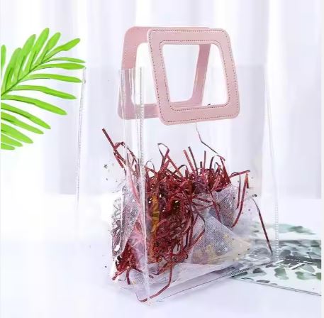 BOLSA ASA CUADRADA CUERINA ROSADA - PVC TRANSPARENTE 24.5x27.5x14